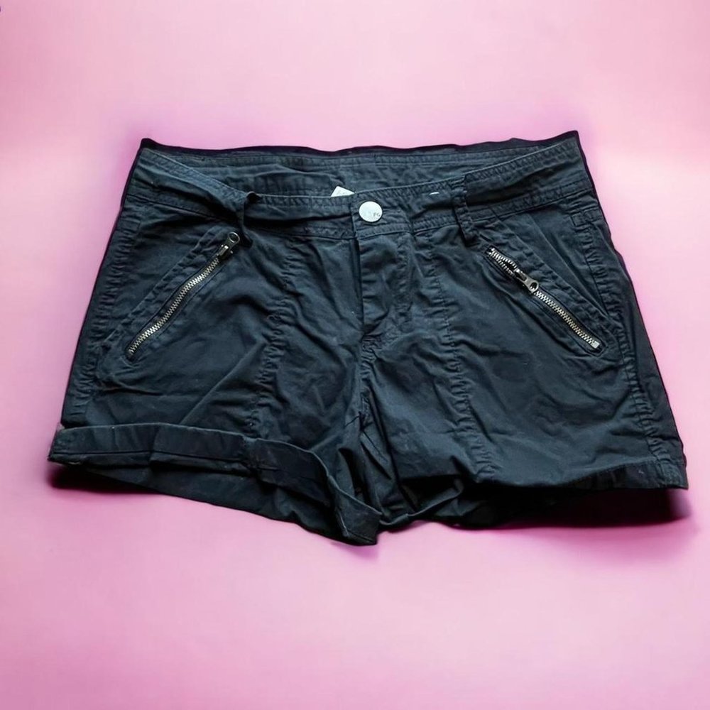 black cargo shorts with zipper pockets. can cuff at the bottom